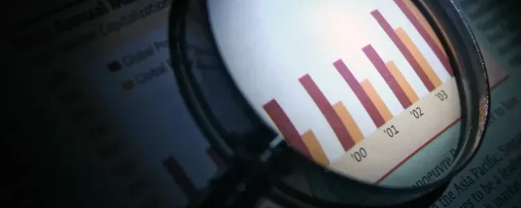A magnifying glass zooming in on some statistics.